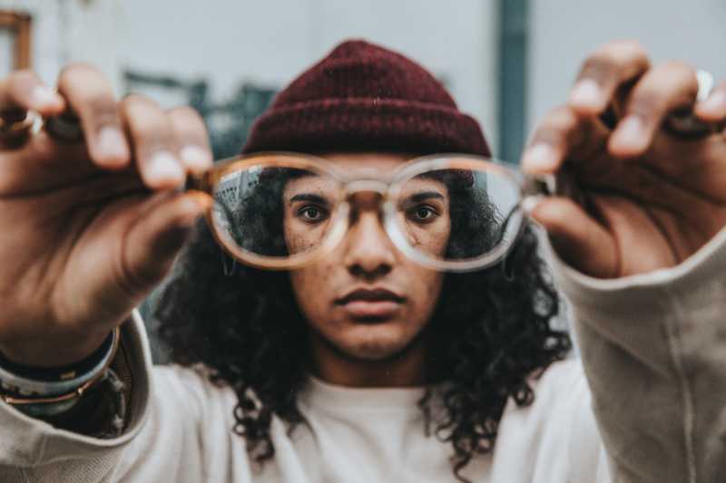 Out-of-focus image of someone using glasses